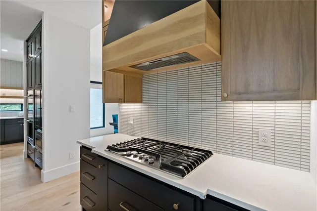 a kitchen with a stove and a microwave