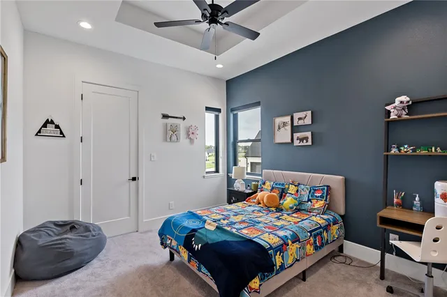 an aerial view of a house with a swimming pool yard and outdoor seating
