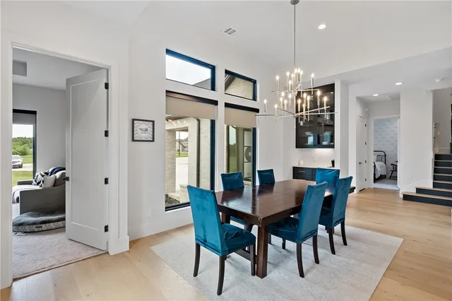 a kitchen with a sink a counter space appliances and cabinets