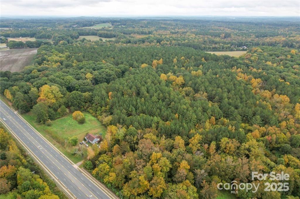 1608 East Main Street Locust, NC 28097 - Photo 3 of 10 a view of a green field with an ocean