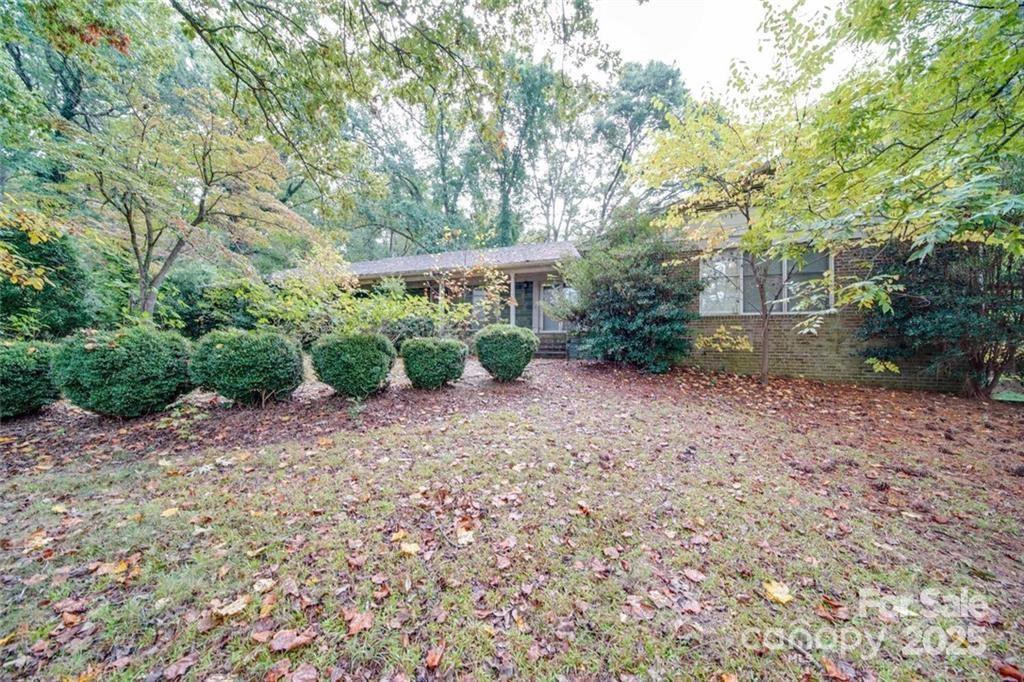 1608 East Main Street Locust, NC 28097 - Photo 6 of 10 a backyard of a house with lots of green space