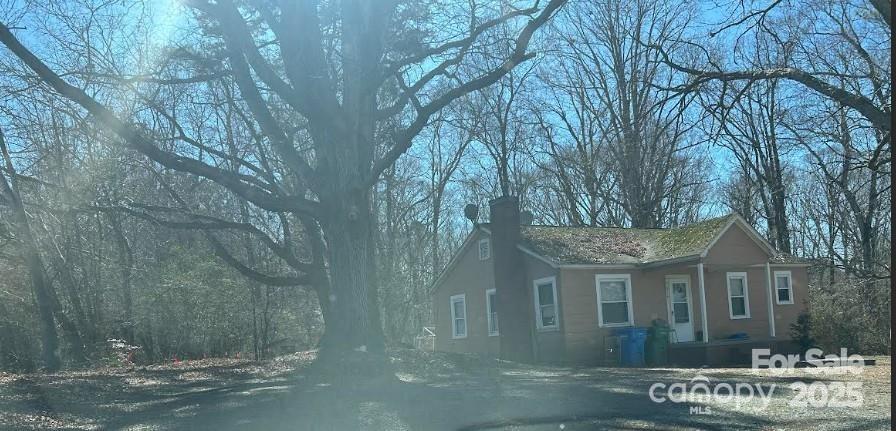 1608 East Main Street Locust, NC 28097 - Photo 8 of 10 a front view of a house with a yard