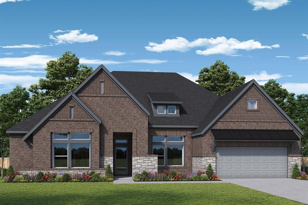 1704 Holly Oak Way Fate, TX 75087 - Photo 1 of 1 a front view of a house with a garden