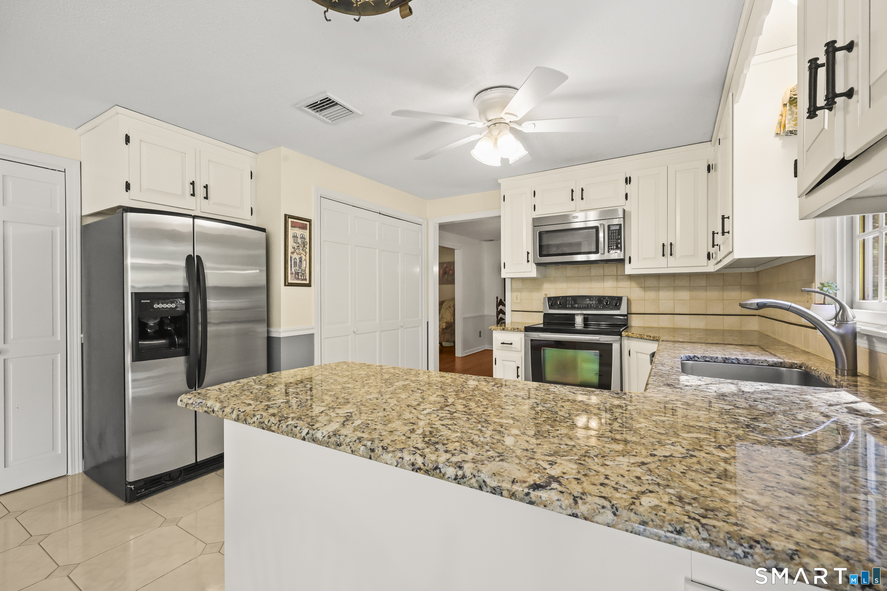 17 Briar Hill Road Avon, CT 06001 - Photo 28 of 38 Features granite counter tops. lots of storage, and bright morning sunshine that fills the room. Open to the living room and family room. Plenty of options for future owners.