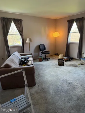 a room with furniture and a window