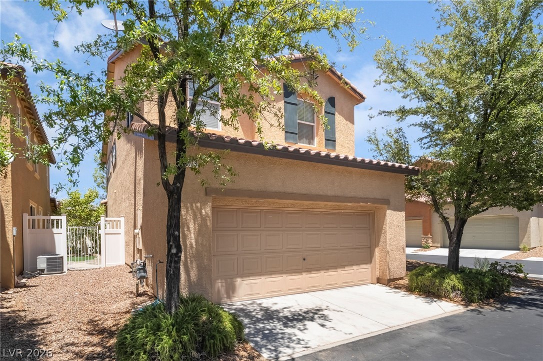 3175 Via Seranova Henderson, NV 89044 - Photo 6 of 45 This charming home offers a convenient attached garage, perfect for modern living.