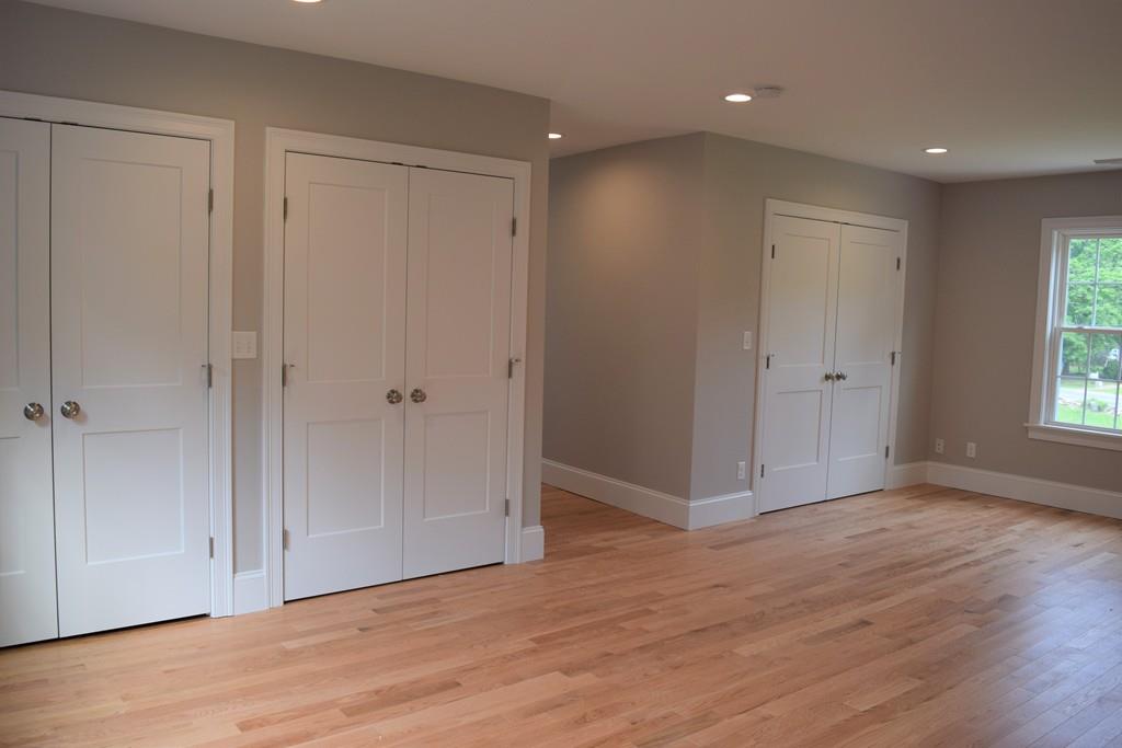 298 New Bedford Road Rochester, MA 02770 - Photo 23 of 31 a view of an empty room with wooden floor