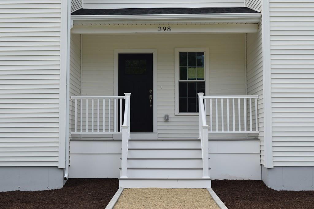 298 New Bedford Road Rochester, MA 02770 - Photo 3 of 31 a view of a house with a white door