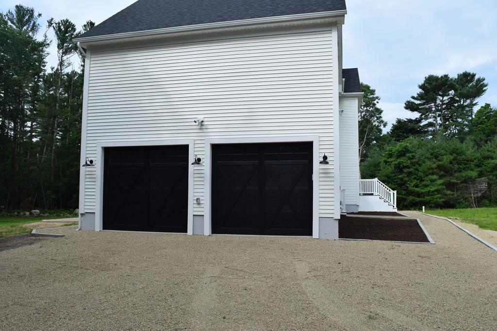 298 New Bedford Road Rochester, MA 02770 - Photo 5 of 31 a view of a house with a yard and garage
