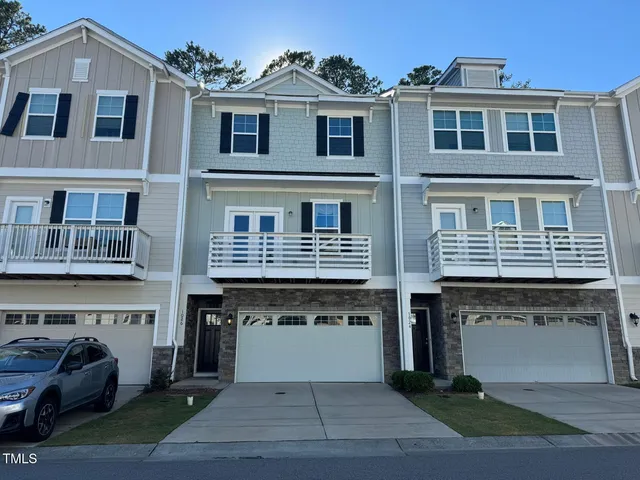 a front view of a building with many windows