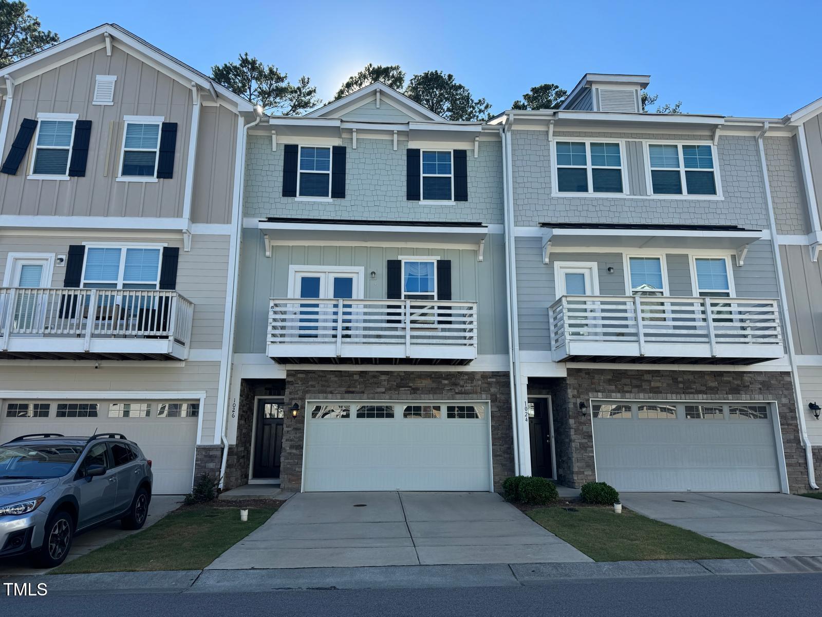 a front view of a building with many windows