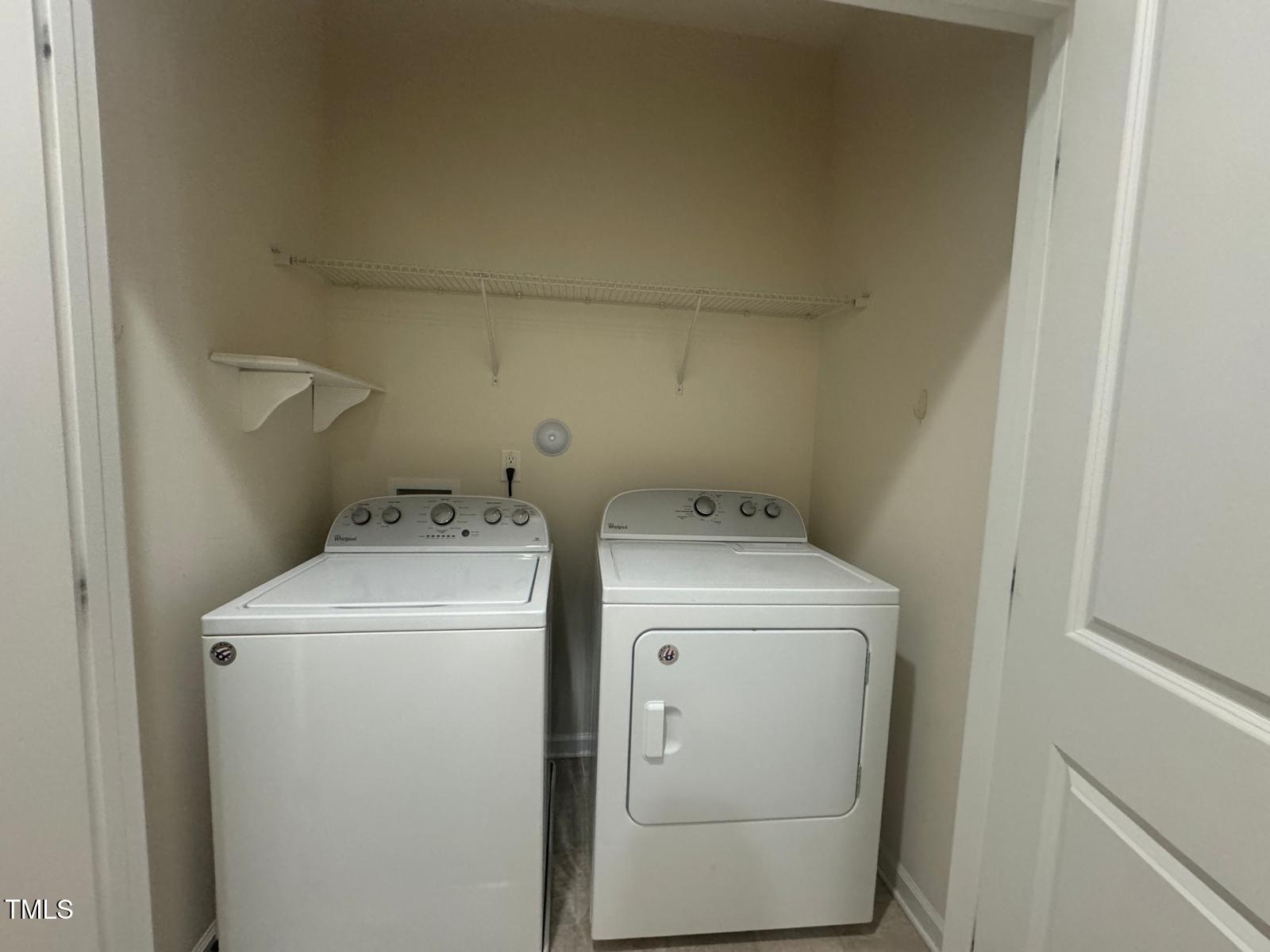 1026 Diamond Dove Lane Apex, NC 27502 - Photo 21 of 22 a utility room with dryer and washer