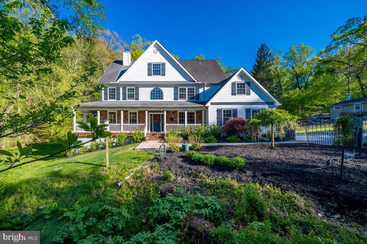972 Smithbridge Road Glen Mills, PA 19342 - Photo 1 of 75 a front view of a house with yard porch and green space