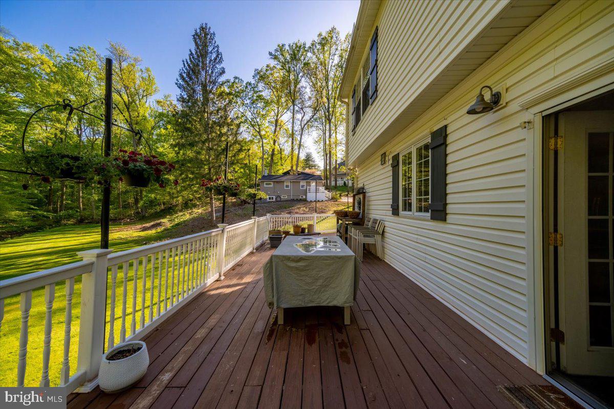 972 Smithbridge Road Glen Mills, PA 19342 - Photo 17 of 75 a view of balcony with chair and wooden floor