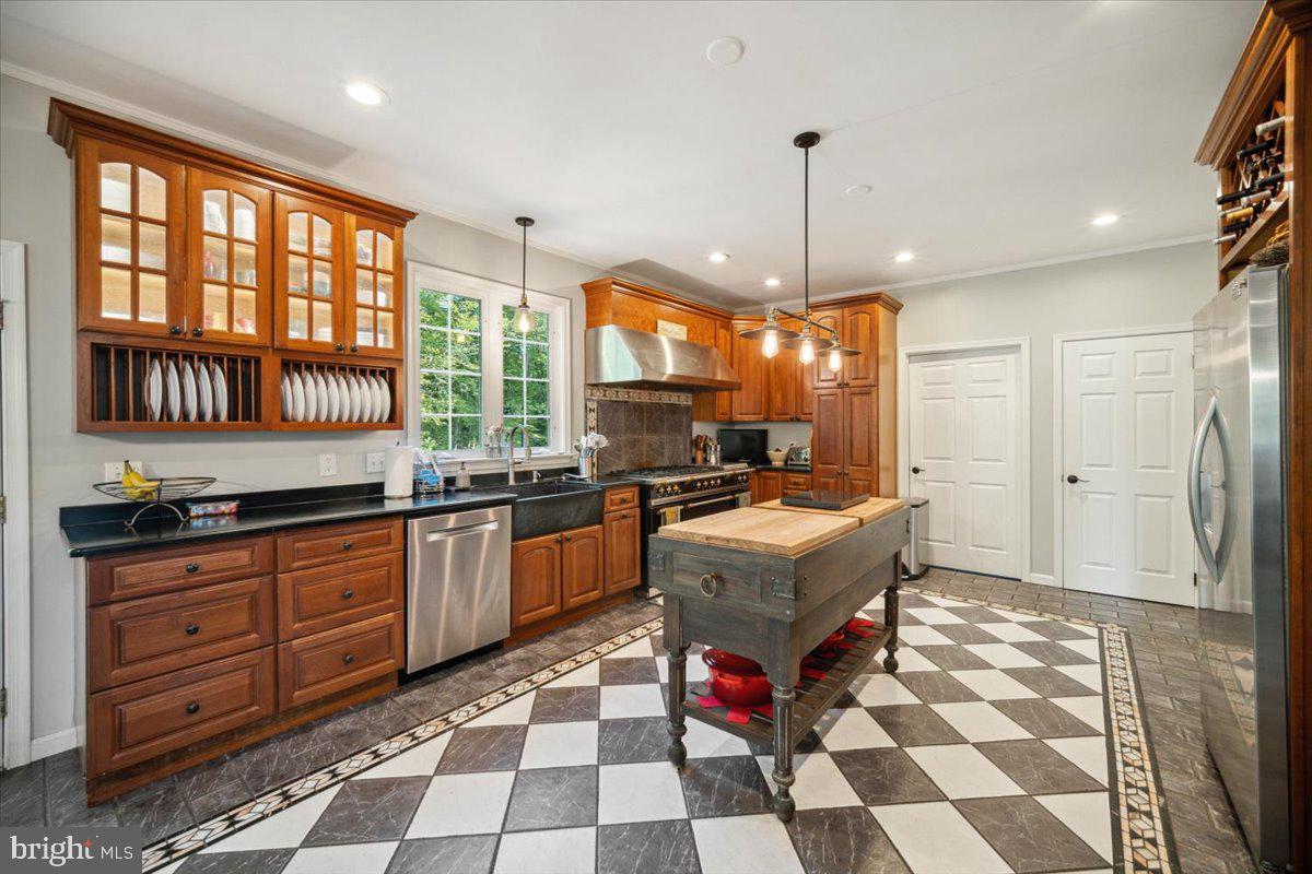 972 Smithbridge Road Glen Mills, PA 19342 - Photo 34 of 75 a kitchen with granite countertop stainless steel appliances a sink and a counter space