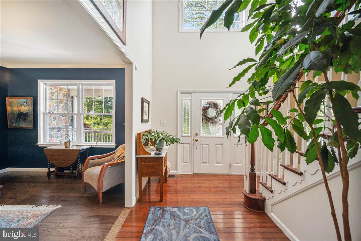972 Smithbridge Road Glen Mills, PA 19342 - Photo 44 of 75 a living room with furniture floor to ceiling window and wooden floor