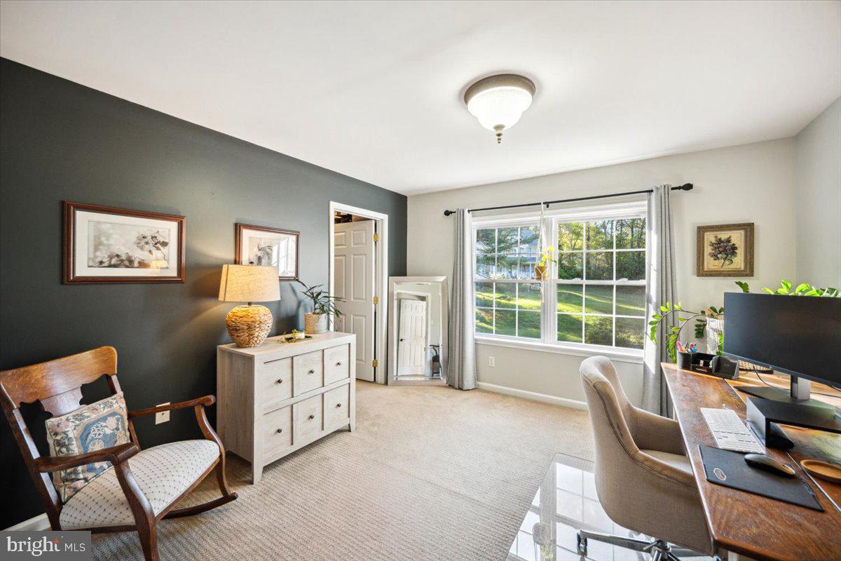 972 Smithbridge Road Glen Mills, PA 19342 - Photo 49 of 75 a living room with furniture a flat screen tv and a window