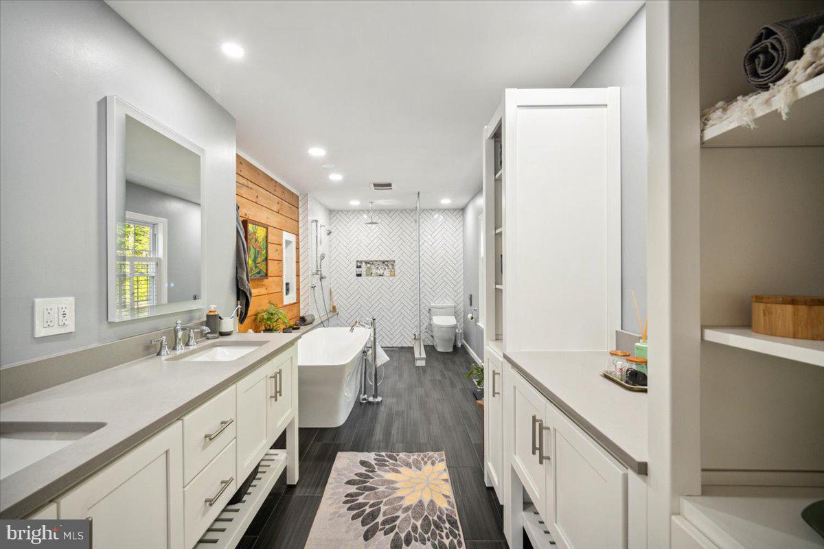 972 Smithbridge Road Glen Mills, PA 19342 - Photo 56 of 75 a spacious bathroom with double vanity and mirrors