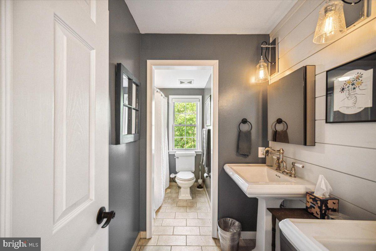 972 Smithbridge Road Glen Mills, PA 19342 - Photo 61 of 75 a bathroom with a sink and a mirror