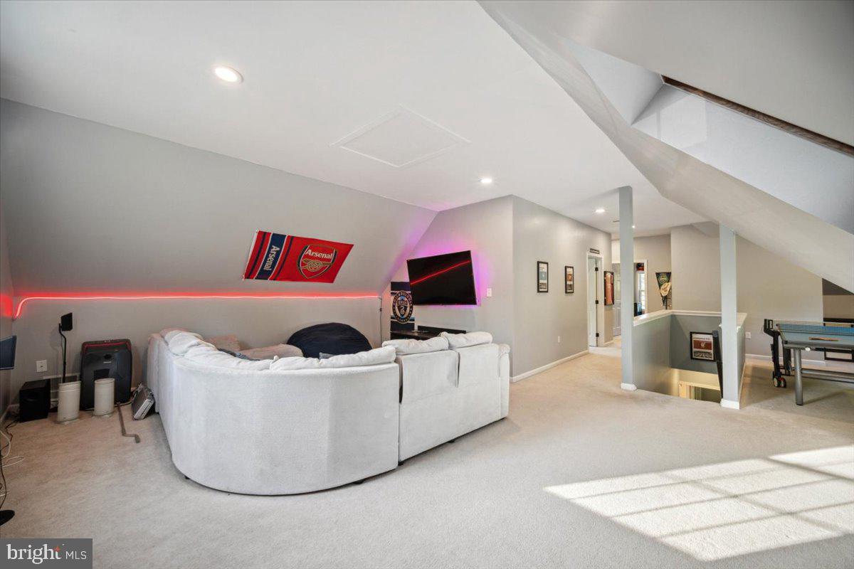 972 Smithbridge Road Glen Mills, PA 19342 - Photo 65 of 75 a living room with furniture and a flat screen tv