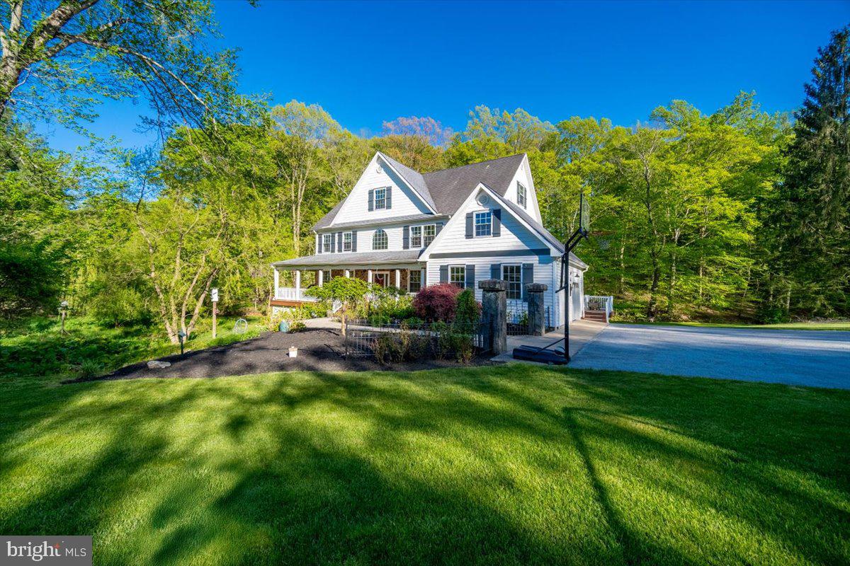 972 Smithbridge Road Glen Mills, PA 19342 - Photo 7 of 75 a view of a house with a big yard potted plants and large tree