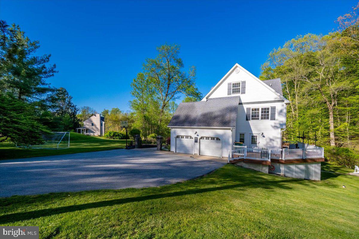 972 Smithbridge Road Glen Mills, PA 19342 - Photo 9 of 75 a house view with a garden space