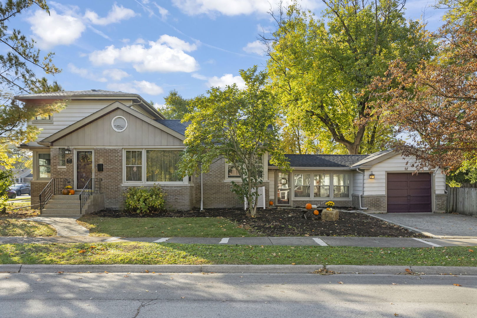 1913 Birch Road Homewood, IL 60430 - Photo 1 of 22 a front view of a house with a yard and garage