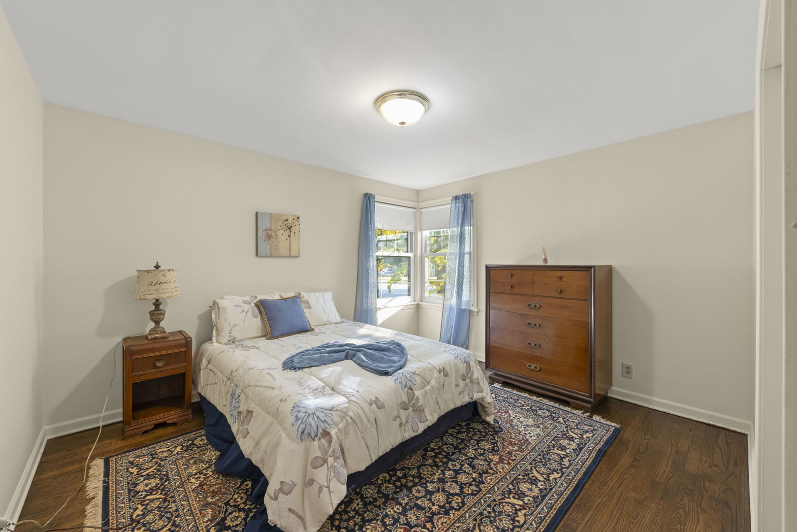 1913 Birch Road Homewood, IL 60430 - Photo 13 of 22 a bedroom with a bed and a dresser