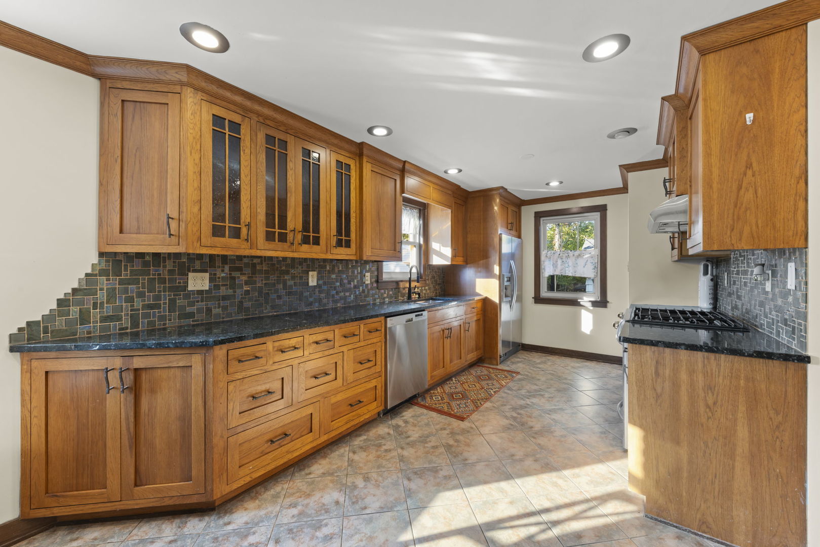 1913 Birch Road Homewood, IL 60430 - Photo 8 of 22 a kitchen with granite countertop a sink cabinets and window