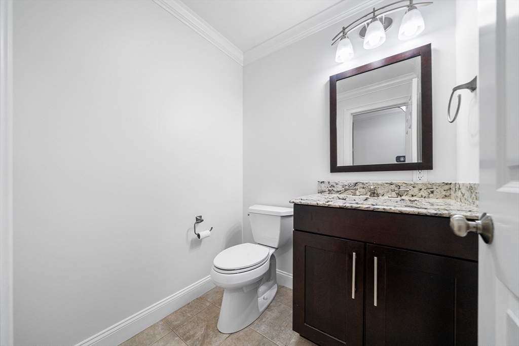 215 Rangeway Road, Unit 31 Billerica, MA 01862 - Photo 13 of 40 a bathroom with a toilet sink and mirror