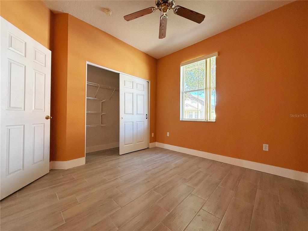 194 Sand Ridge Drive Davenport, FL 33896 - Photo 11 of 17 a view of an empty room with a window