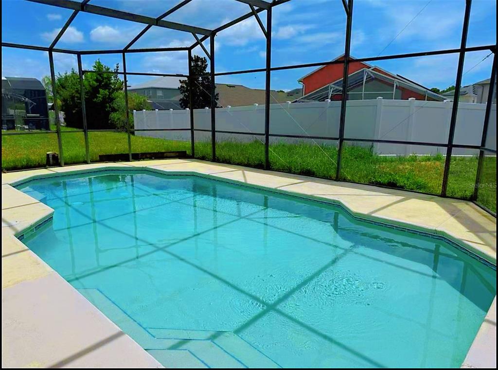 194 Sand Ridge Drive Davenport, FL 33896 - Photo 17 of 17 a view of a tennis ground with a small pool