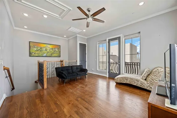 a view of a livingroom with workspace and a window