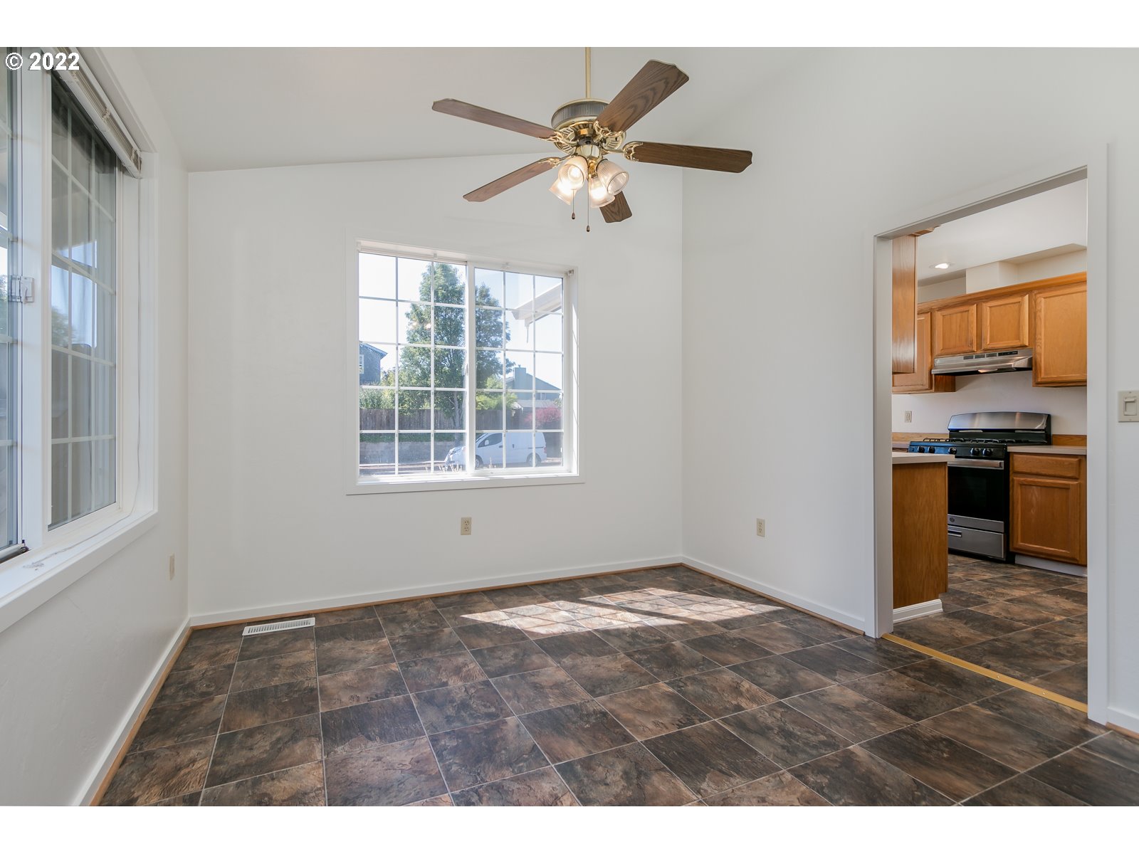 2491 Mangan Street Eugene, OR 97402 - Photo 12 of 20 a view of an empty room with window and cabinet