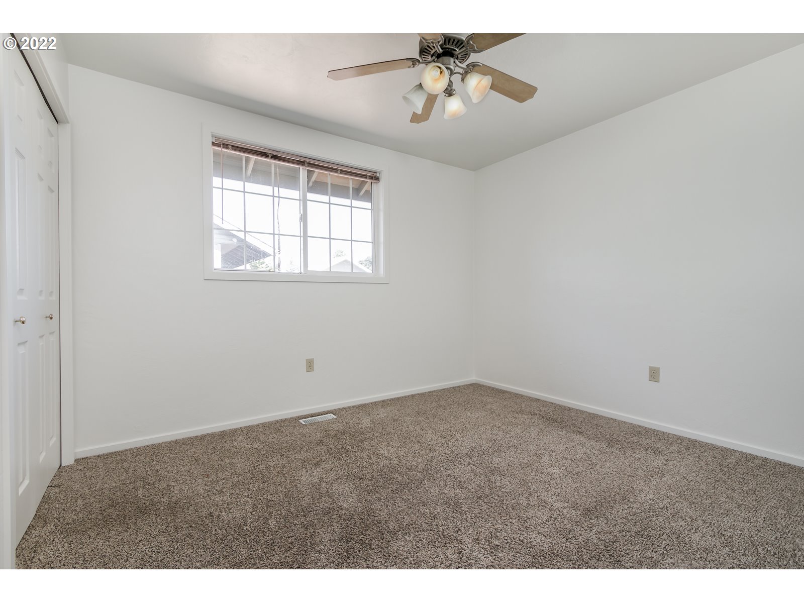 2491 Mangan Street Eugene, OR 97402 - Photo 17 of 20 a view of an empty room with a window