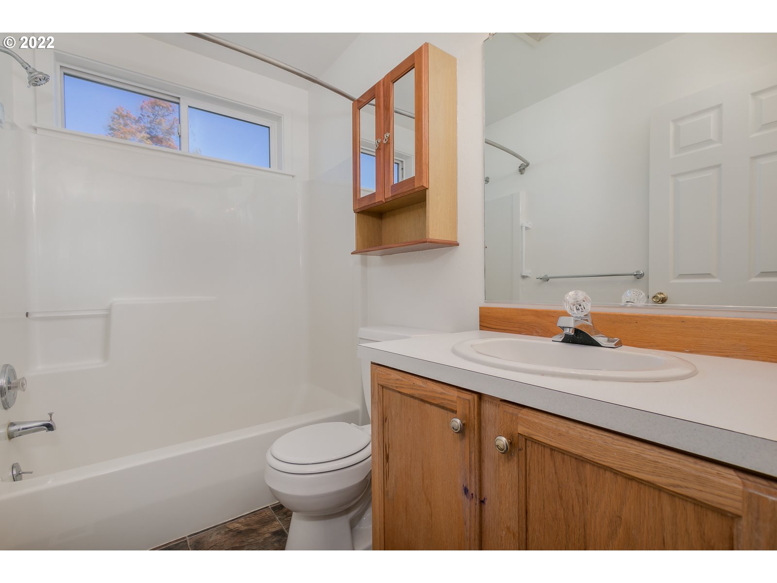 2491 Mangan Street Eugene, OR 97402 - Photo 18 of 20 a bathroom with a sink a toilet and a mirror
