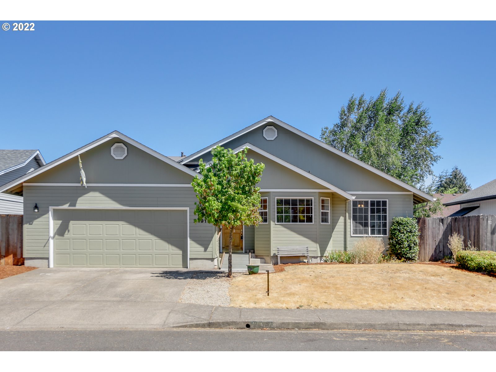 2491 Mangan Street Eugene, OR 97402 - Photo 2 of 20 a view of a house with a yard and potted plants