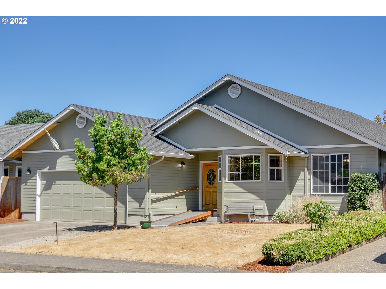 2491 Mangan Street Eugene, OR 97402 - Photo 3 of 20 a view of a house with a yard and potted plants