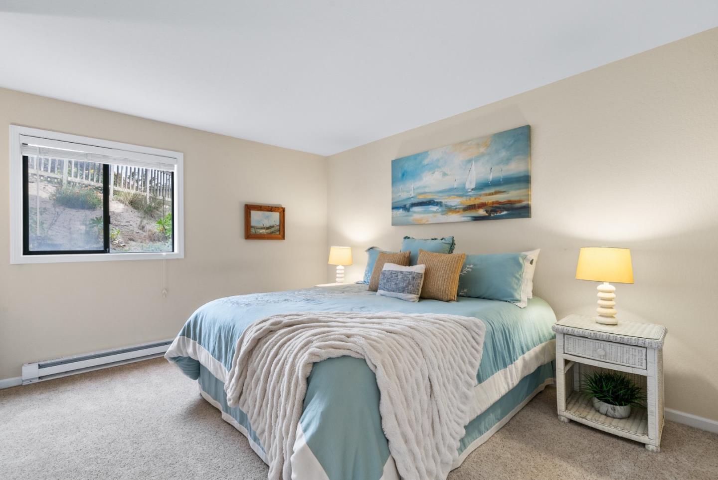 101 Shell Road, Unit 171 Watsonville, CA 95076 - Photo 18 of 31 a bedroom with a bed and a painting on the wall