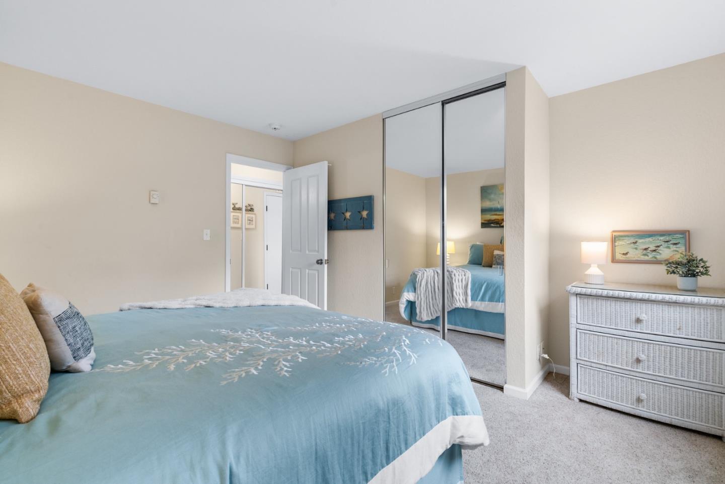 101 Shell Road, Unit 171 Watsonville, CA 95076 - Photo 19 of 31 a bedroom with a bed and a dresser