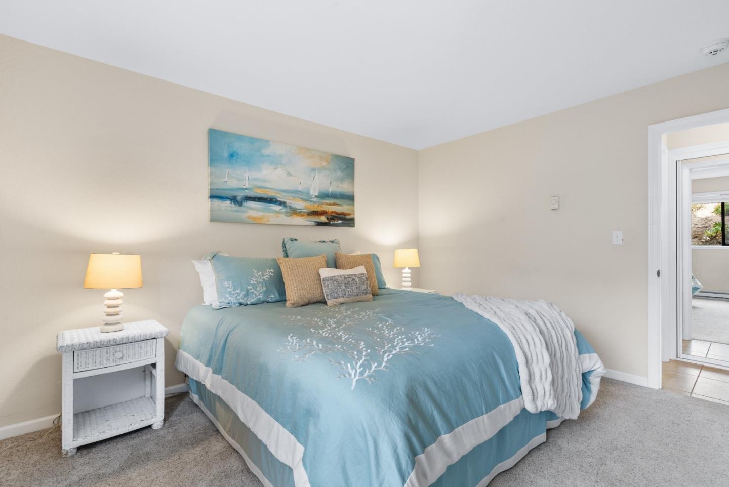 101 Shell Road, Unit 171 Watsonville, CA 95076 - Photo 20 of 31 a bedroom with a bed and a lamp