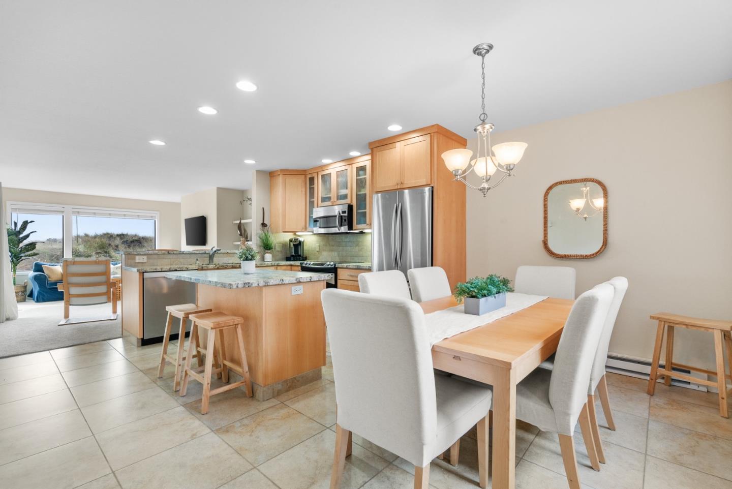 101 Shell Road, Unit 171 Watsonville, CA 95076 - Photo 9 of 31 a dining room filled with lots of chairs a glass table and chairs