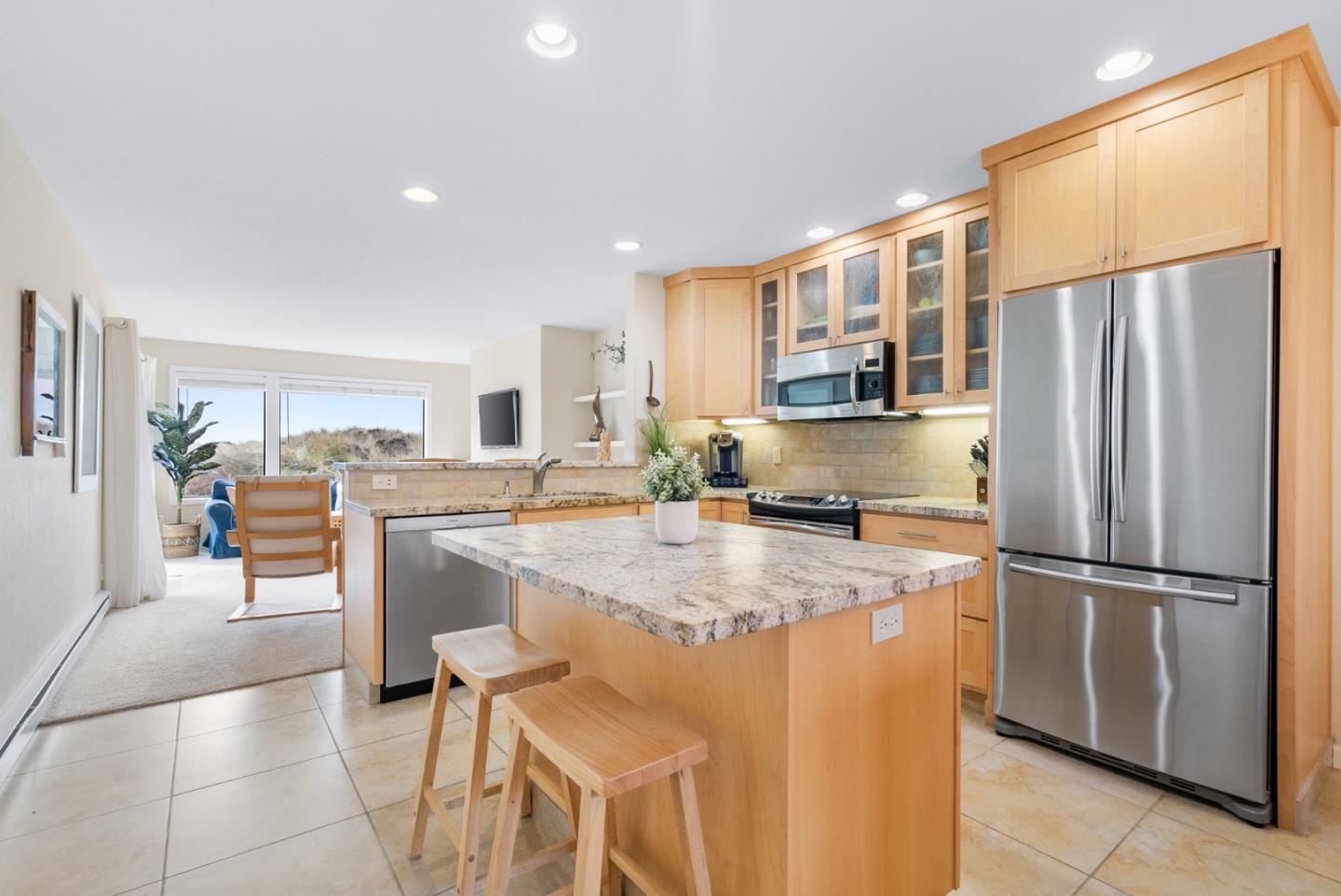 101 Shell Road, Unit 171 Watsonville, CA 95076 - Photo 10 of 31 a kitchen with stainless steel appliances granite countertop a refrigerator and a stove