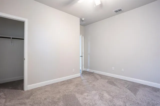 a kitchen with a stove cabinets and wooden floor