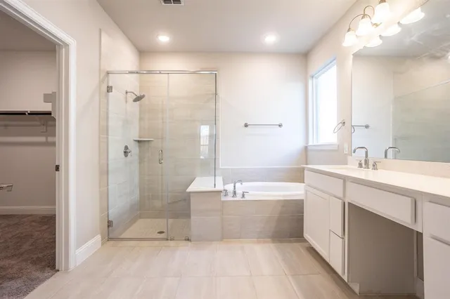 a bathroom with a shower and a sink