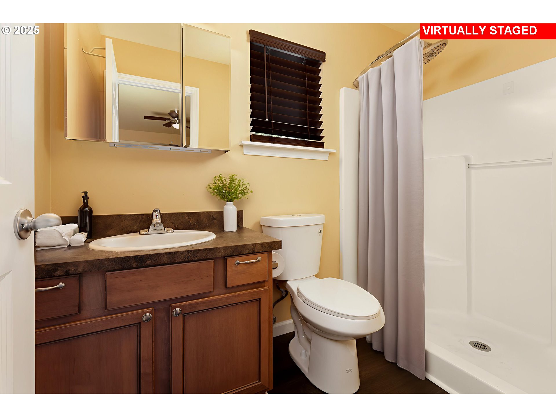 1016 Clark Street The Dalles, OR 97058 - Photo 11 of 24 a bathroom with a sink a toilet and mirror