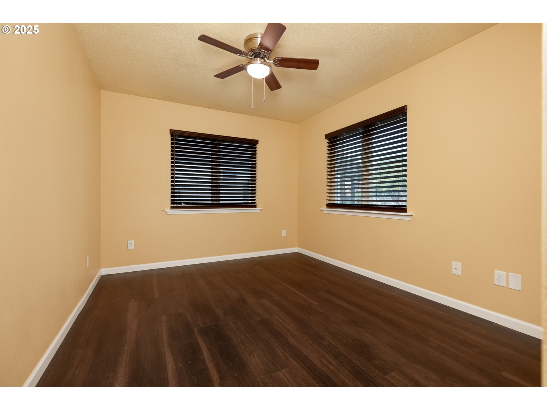 1016 Clark Street The Dalles, OR 97058 - Photo 14 of 24 a view of an empty room with a window and wooden floor
