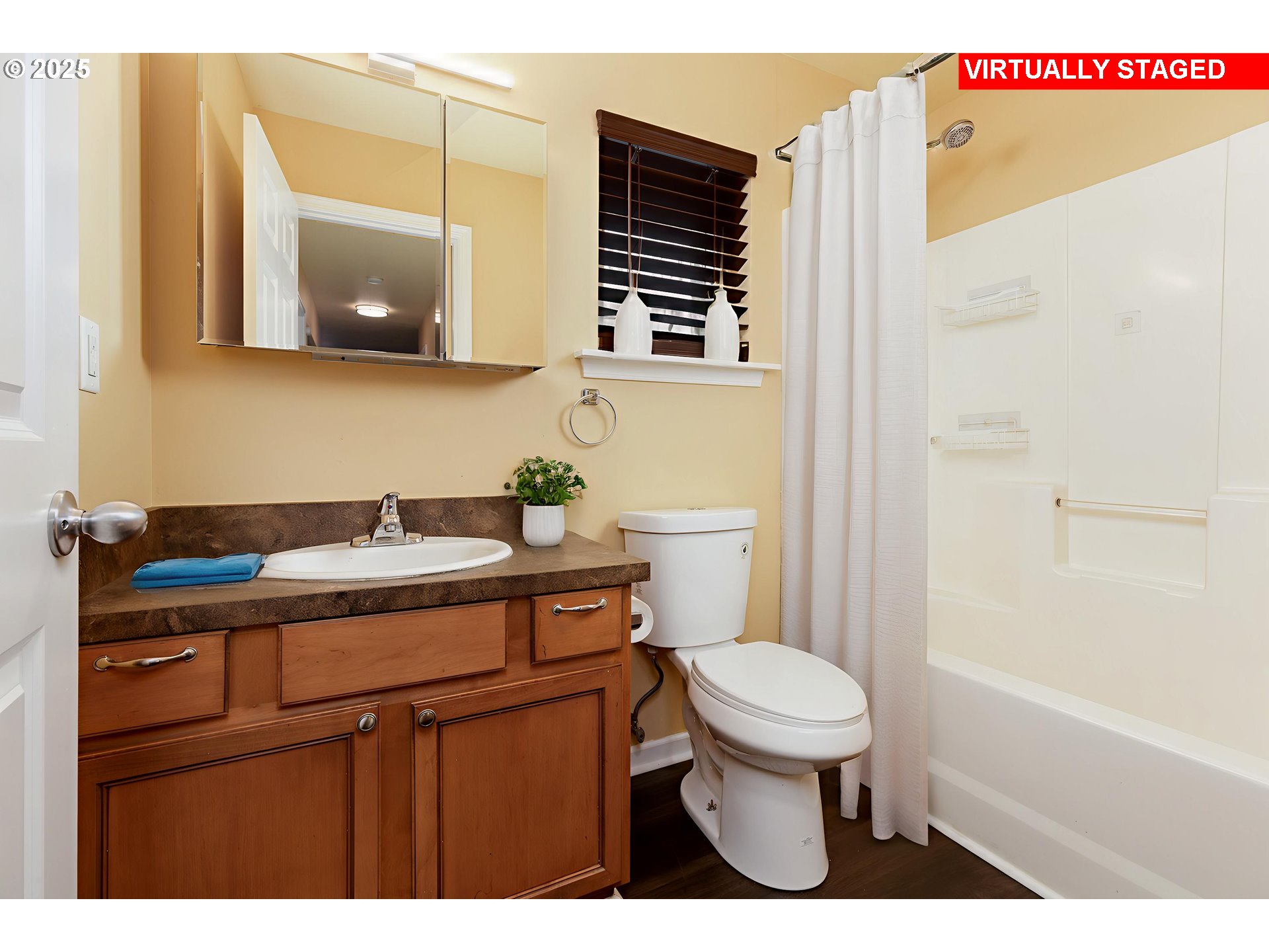 1016 Clark Street The Dalles, OR 97058 - Photo 18 of 24 a bathroom with a toilet a sink and a mirror