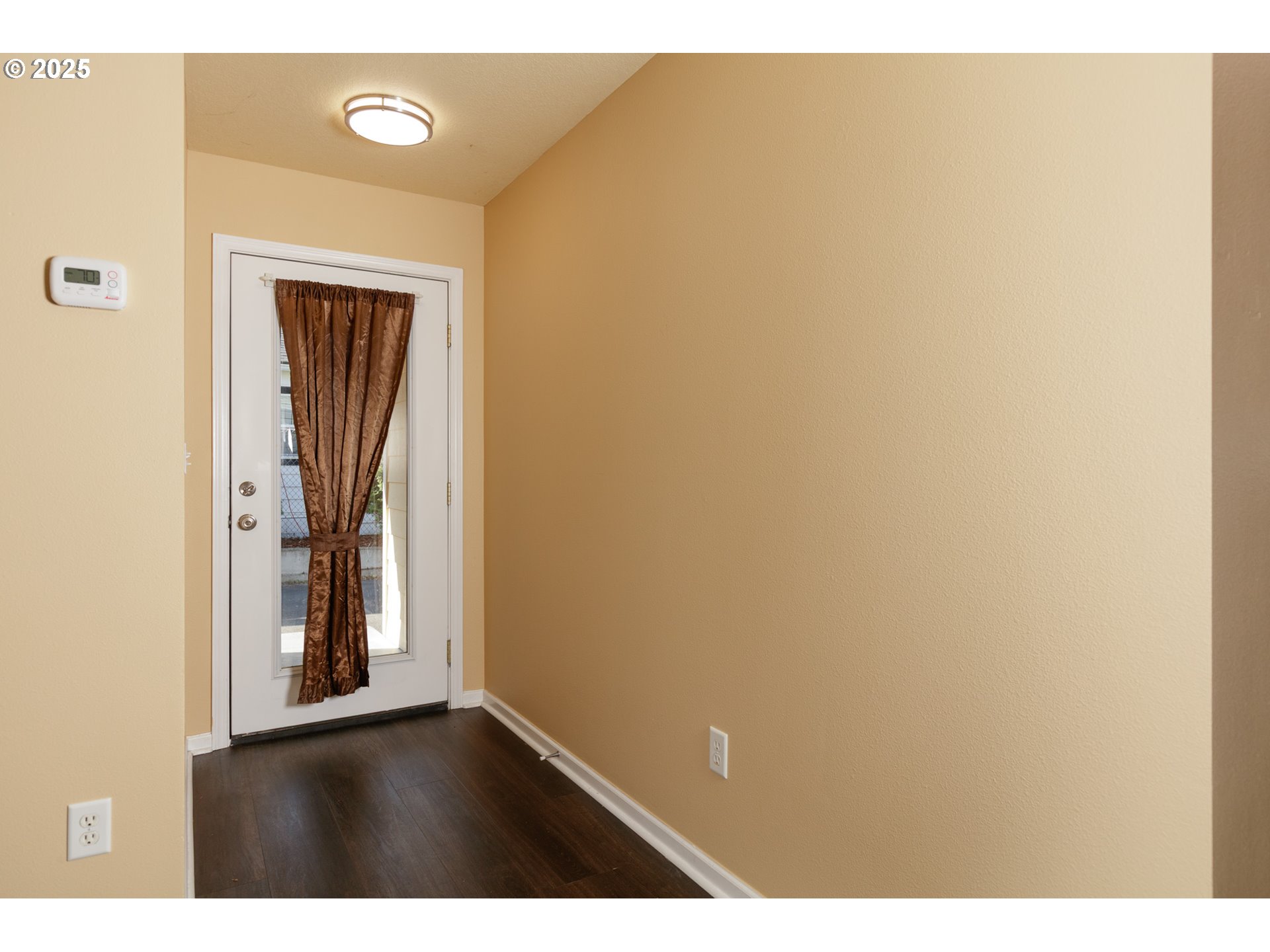 1016 Clark Street The Dalles, OR 97058 - Photo 3 of 24 view of an empty room with wooden door