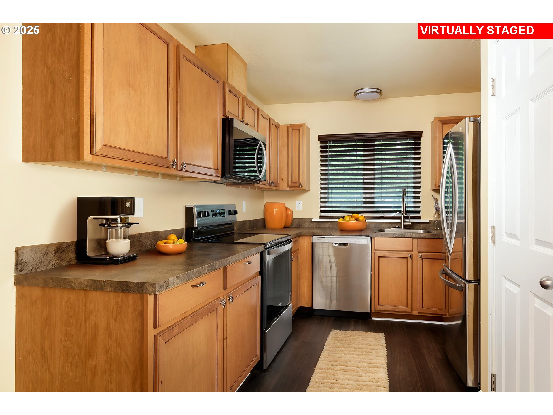 1016 Clark Street The Dalles, OR 97058 - Photo 6 of 24 a kitchen with stainless steel appliances granite countertop a sink stove and cabinets